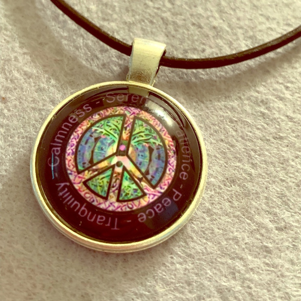 Peace pendant necklace on leather cord